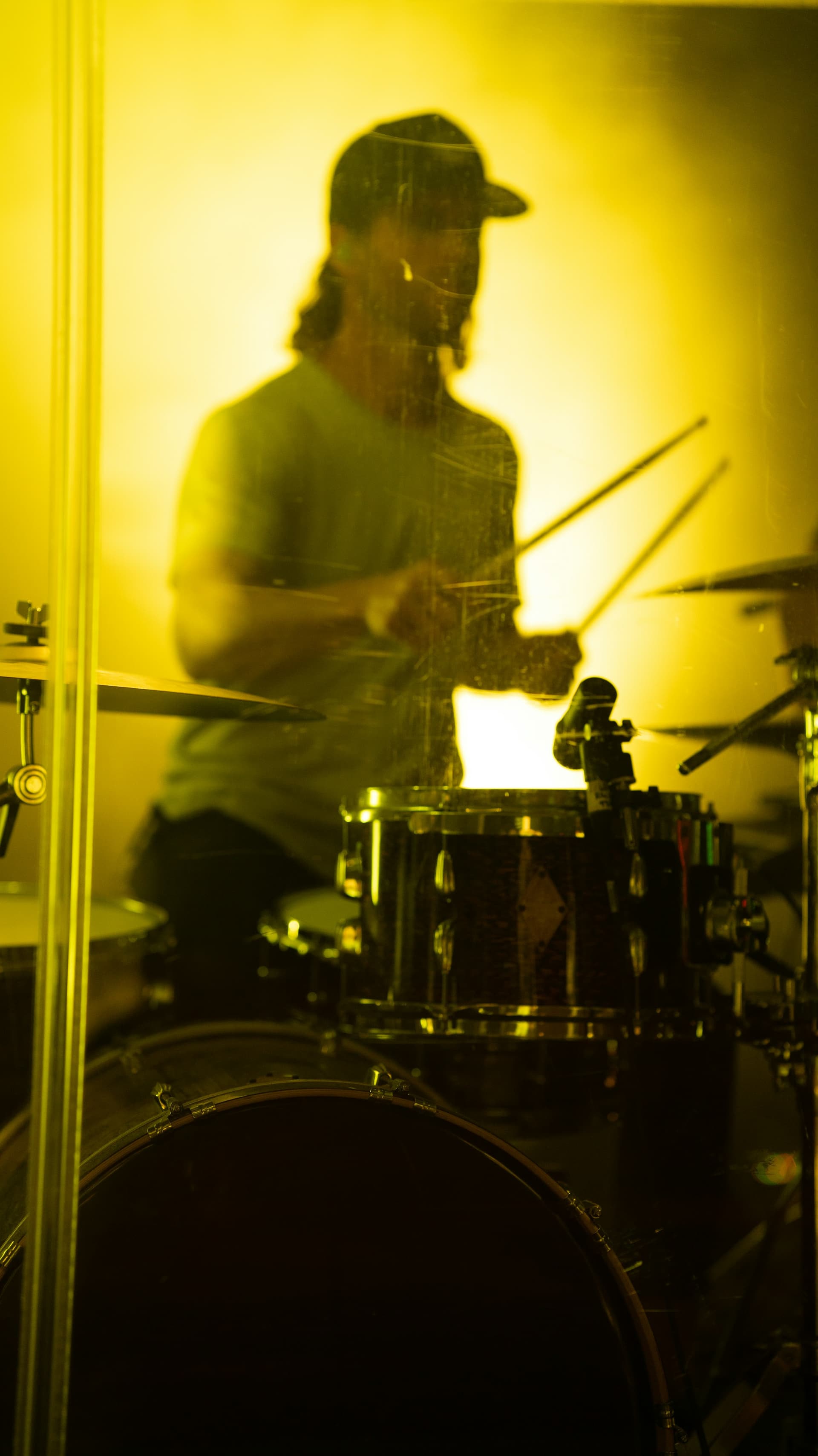 A drummer playing a full kit.