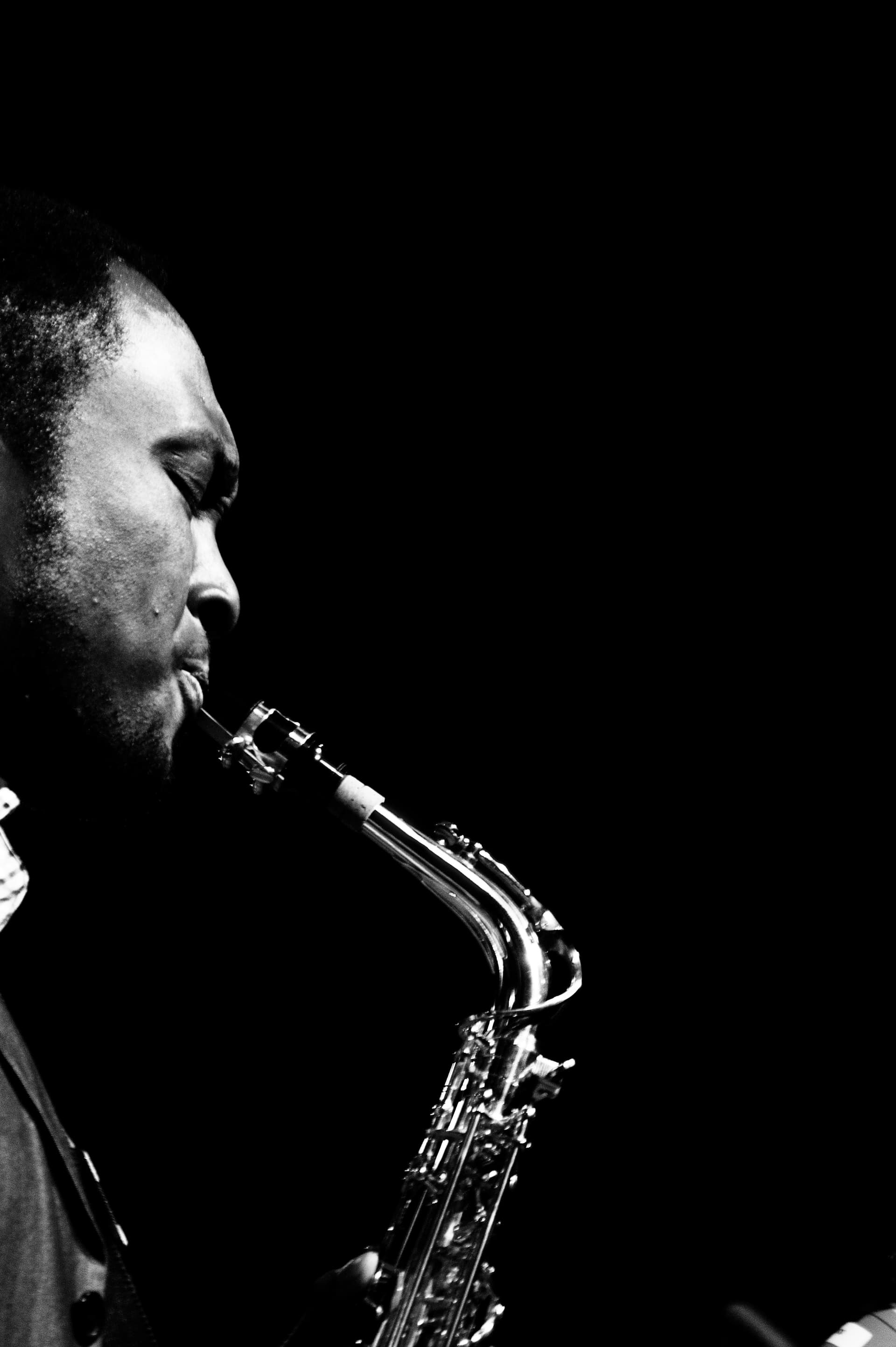 A saxophonist mid-performance.