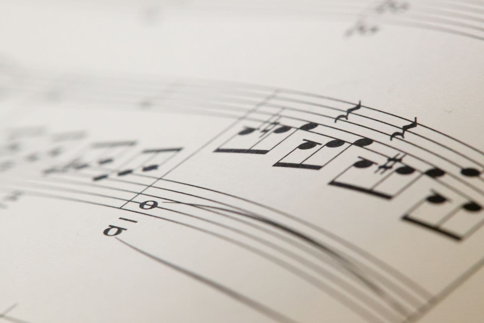Close-up of printed sheet music on an ivory page.