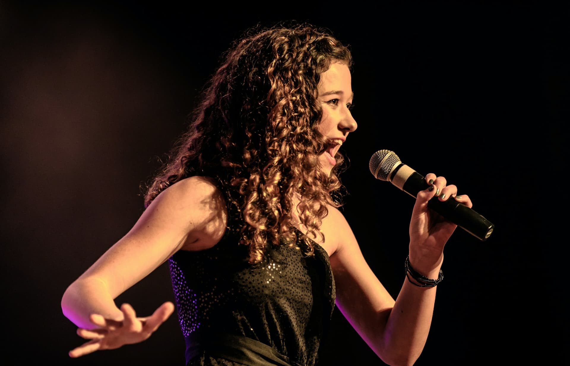A singer performing on stage.