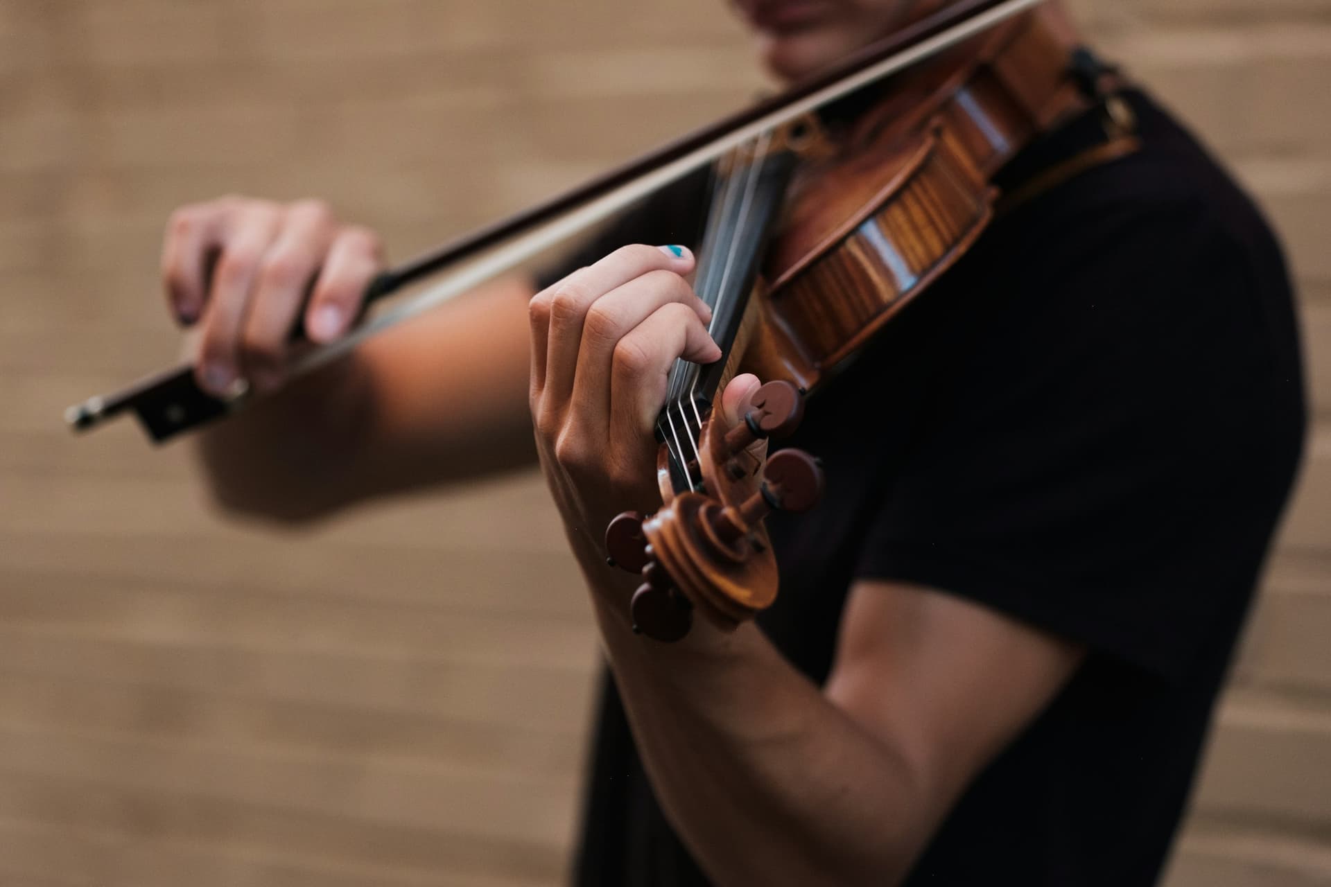A violinist mid-performance.